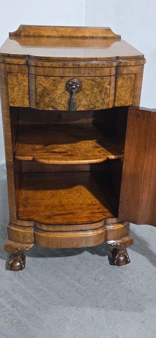 A small burr walnut side cabinet with a single upper drawer over a cupboard door, raised on carved cabriole legs with claw-and-ball feet. View IX