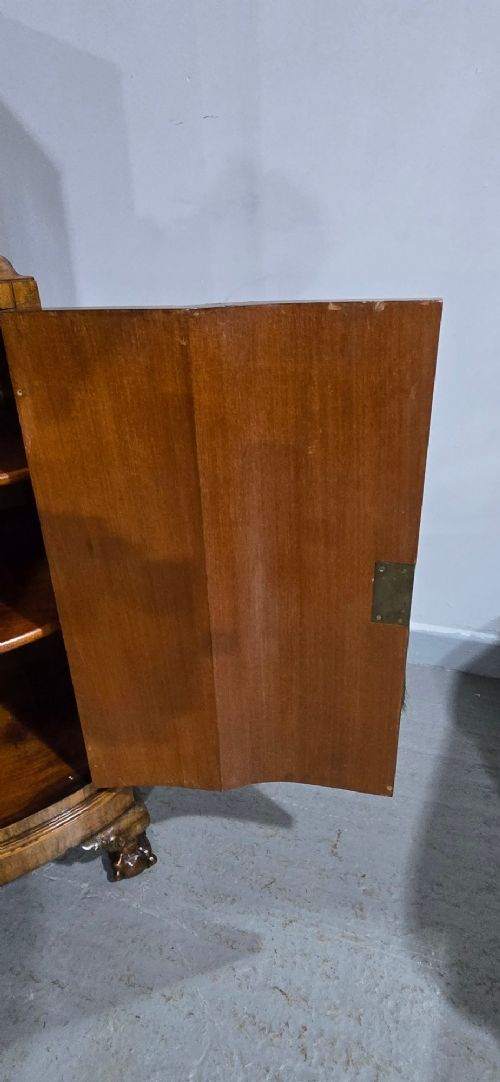 A two-section burr walnut linen press featuring a breakfront profile, upper drawers with drop handles, lower cupboard doors, and carved cabriole legs. View XIII
