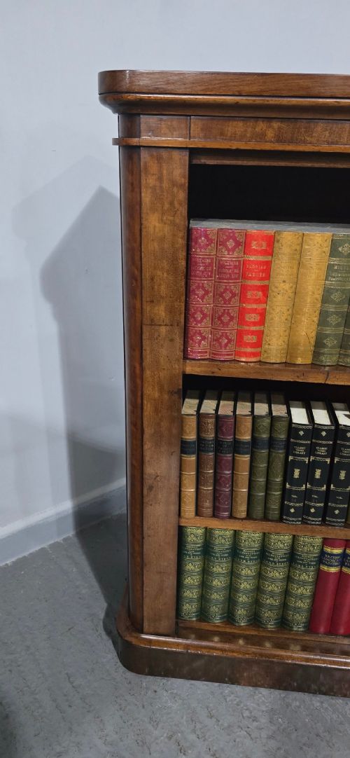 A solid mahogany Victorian open bookcase featuring adjustable internal shelves and a solid plinth base filled with books. View X