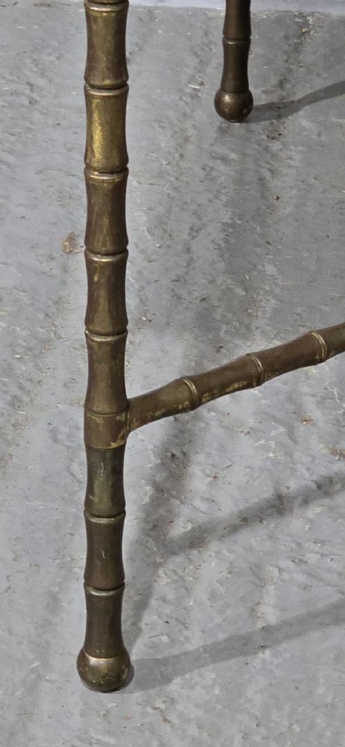 A rectangular French coffee table featuring a white veined marble top resting on a gilt brass faux-bamboo frame with an X-shaped stretcher. View V