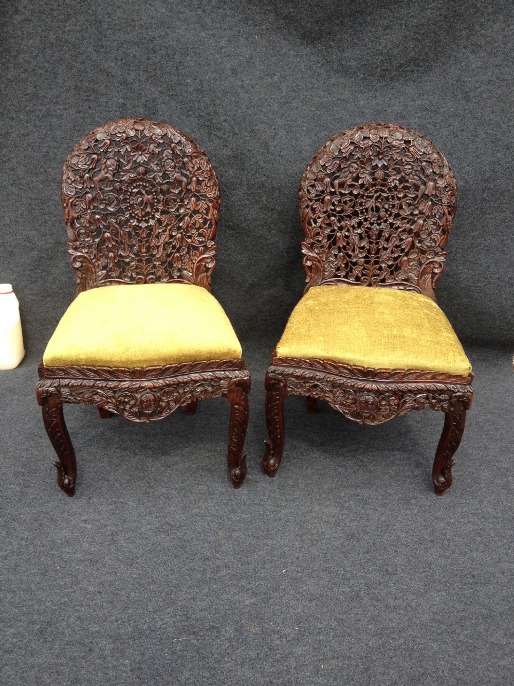 Pair Heavily carved Burmese/Oriental Chairs