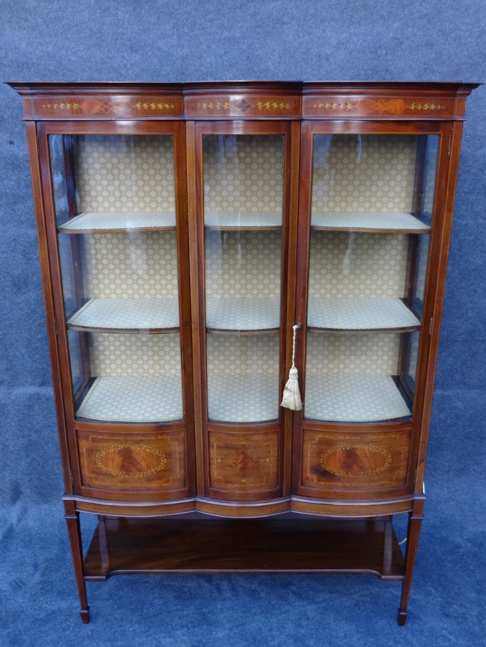 Excellent quality Triple Bowed Mahogany Inlaid Display Cabinet