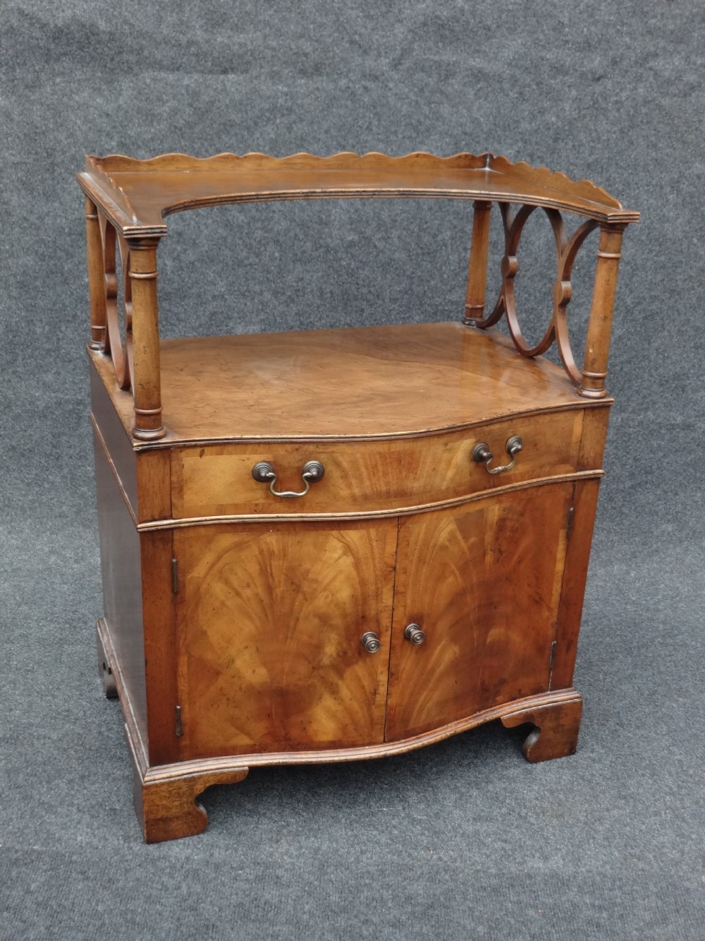 Pretty Serpentine Walnut Cabinet