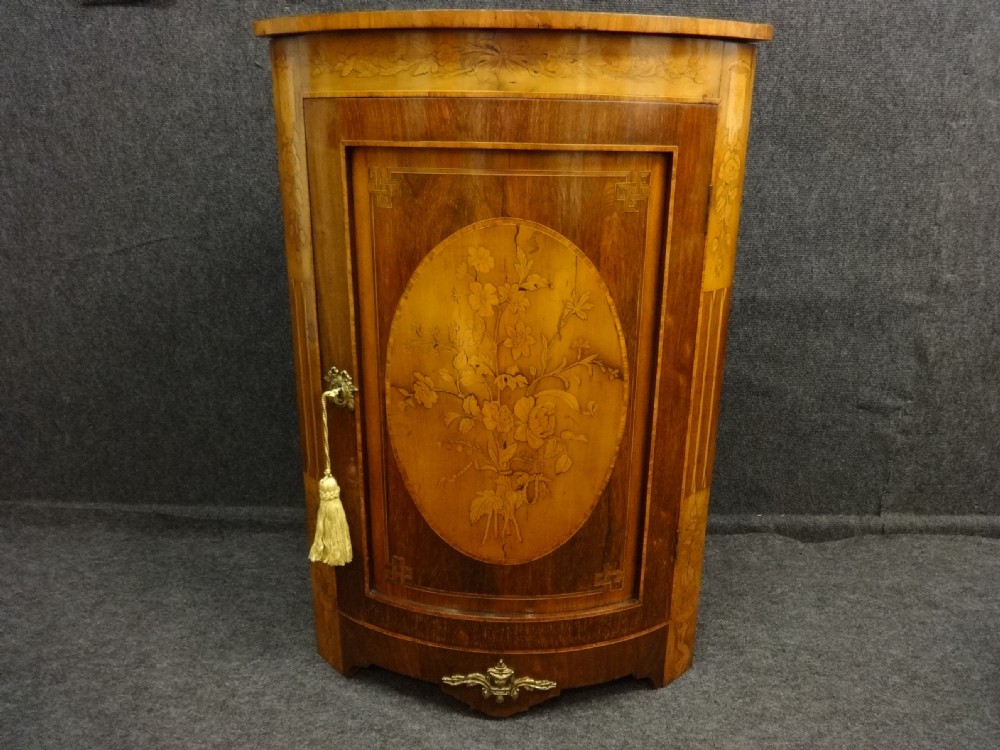 A good Marquetry Corner Cabinet