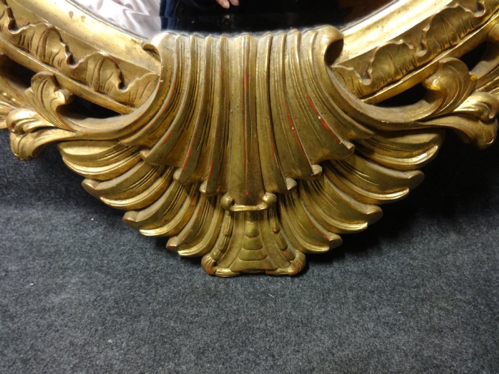 Fine and Large Carved Oval Giltwood Mirror View V