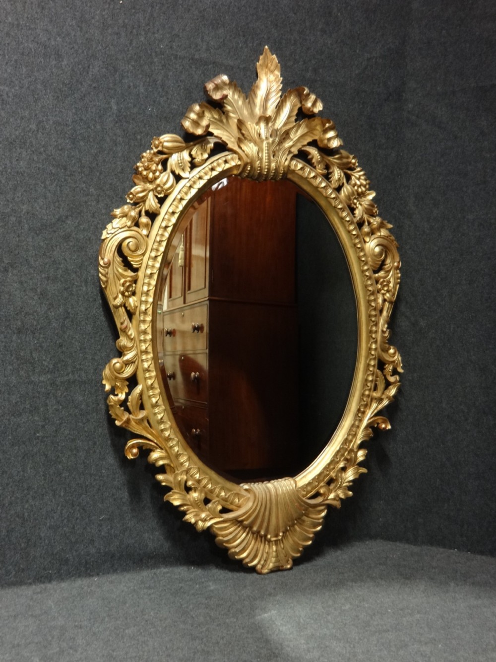 Fine and Large Carved Oval Giltwood Mirror View VI