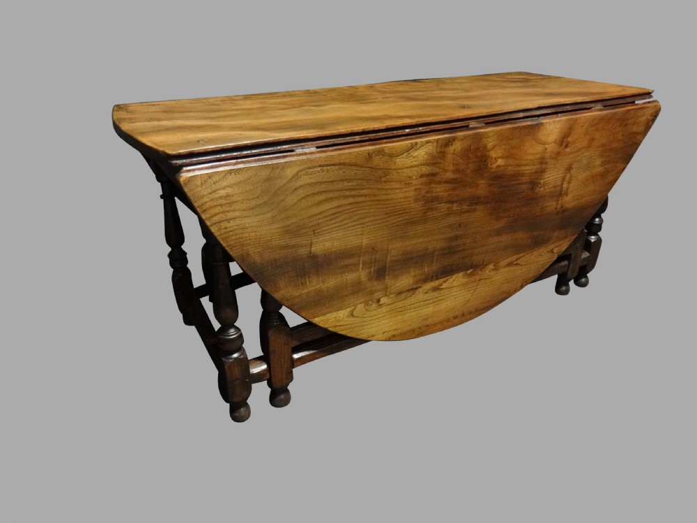 A Superb Huge Elm Drop Leaf Double Gate Dining Table