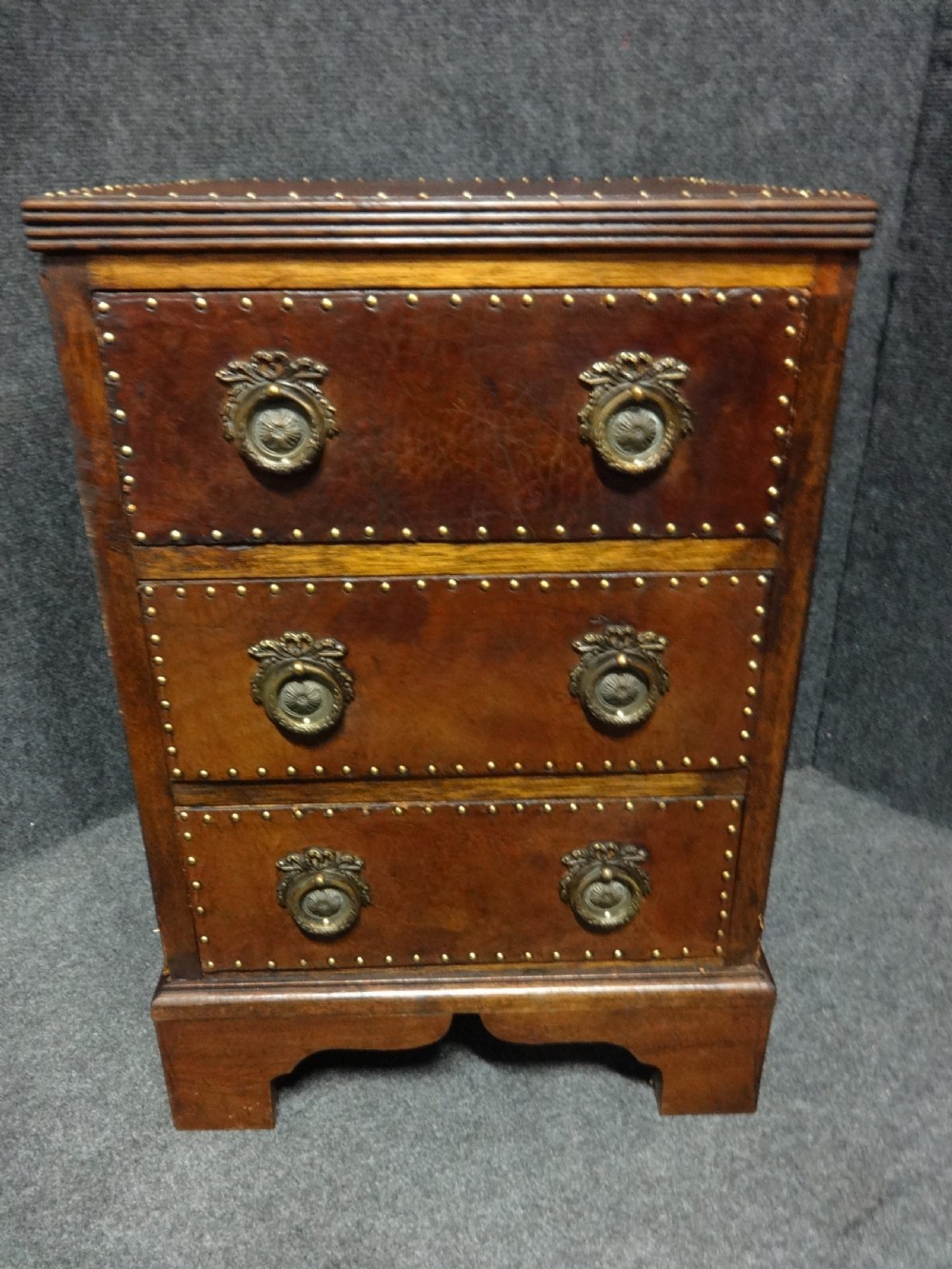 Small Leather Covered Three Drawer Chest of Drawers View II