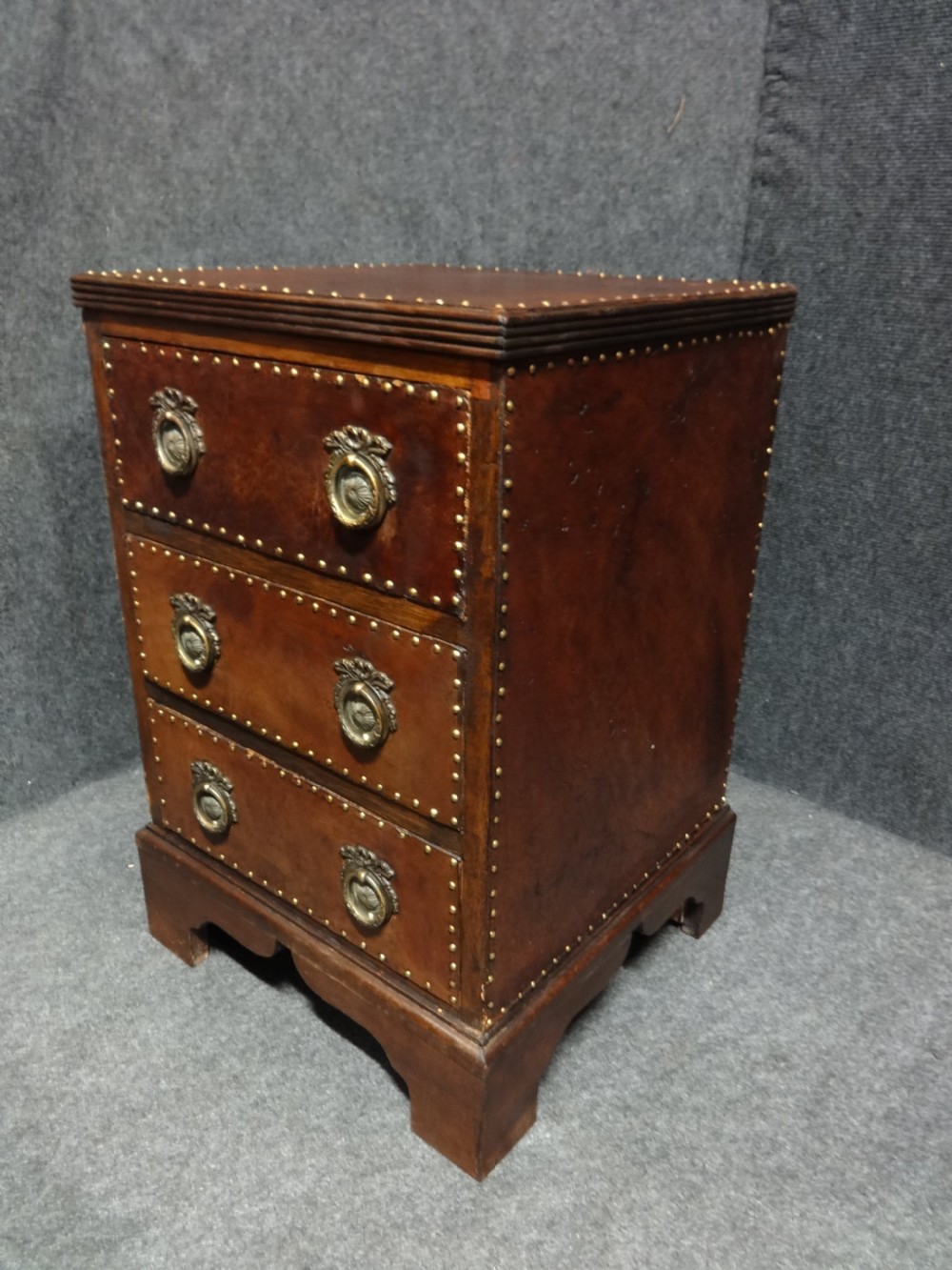 Small Leather Covered Three Drawer Chest of Drawers View III