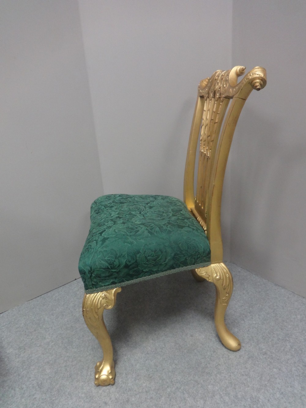 A Georgian giltwood side chair featuring carved cabriole legs with claw and ball feet, an ornate pierced splat back, and green patterned upholstery. View VI