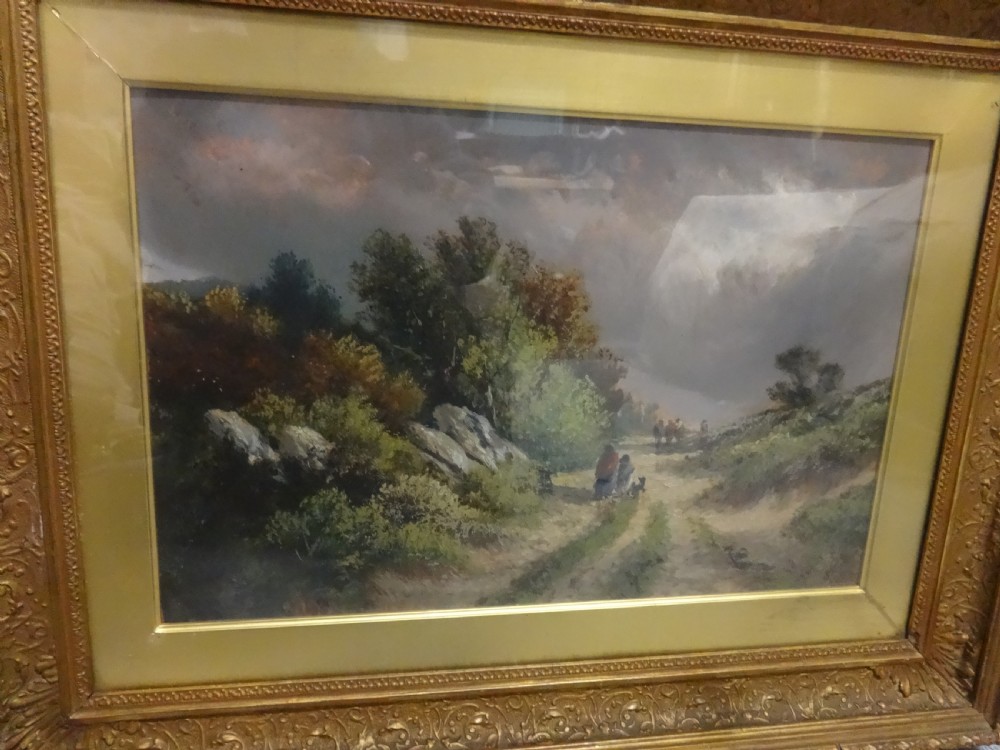 A Victorian landscape oil painting depicting figures on a dirt path through a rural countryside scene, framed in an ornate gilded frame. View IV