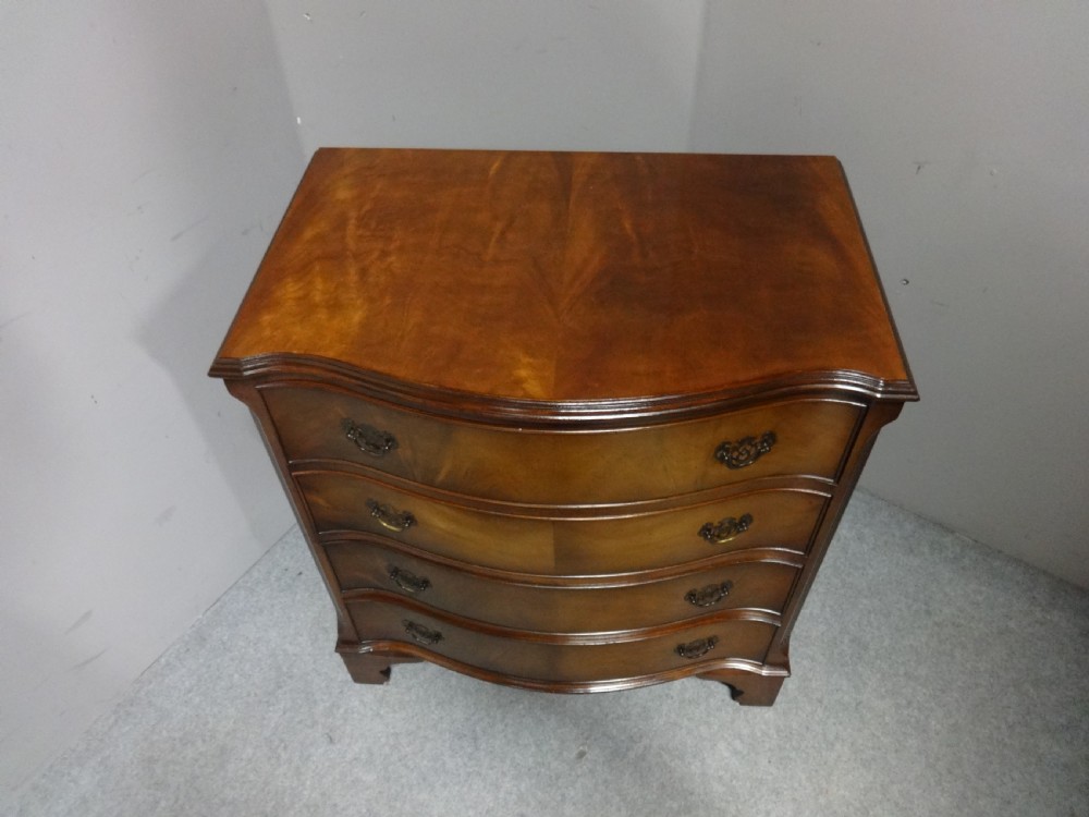 Four Drawer Serpentine Chest View II