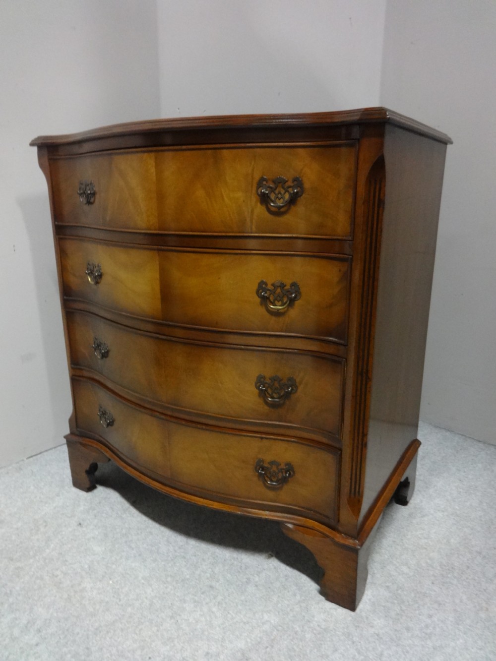 Four Drawer Serpentine Chest View III
