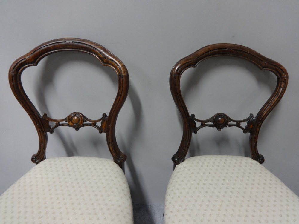 A Pair of Victorian Walnut Hall Chairs View II