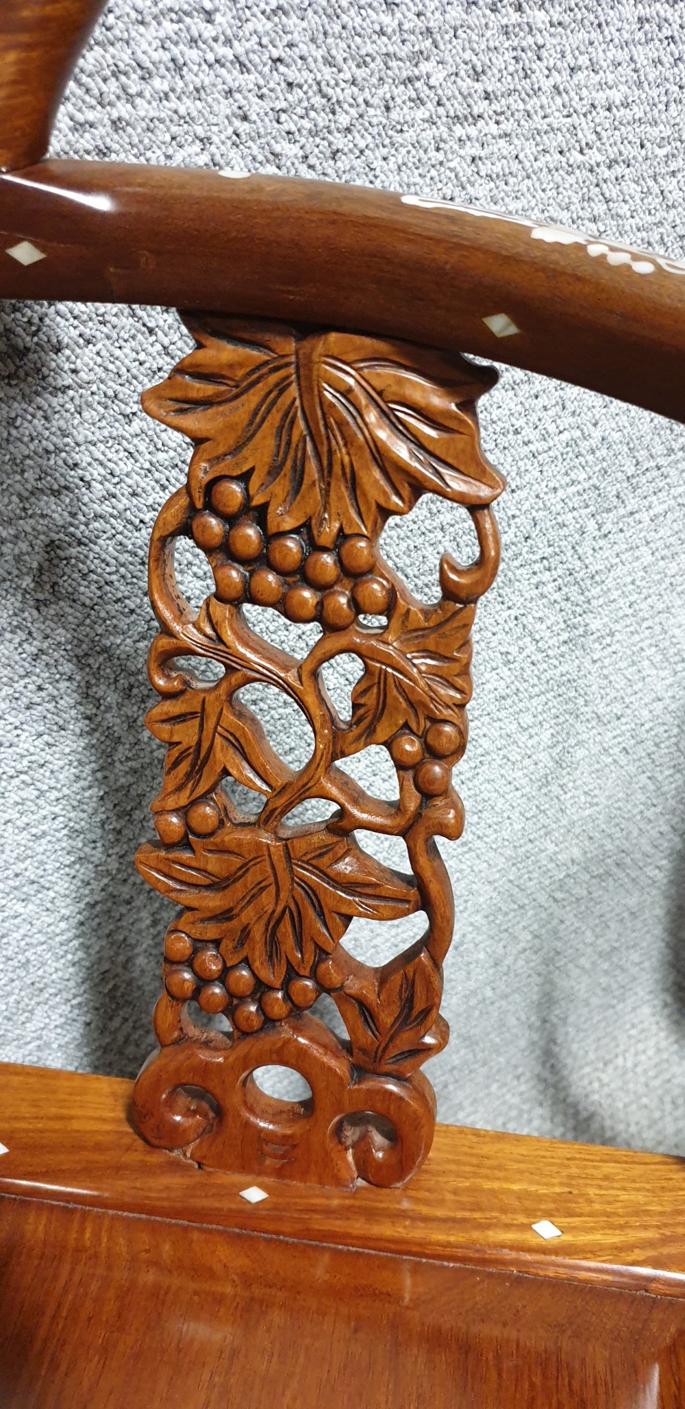 A pair of warm brown hardwood Chinese corner chairs featuring intricate mother-of-pearl floral inlays and carved pierced back splats. View VIII