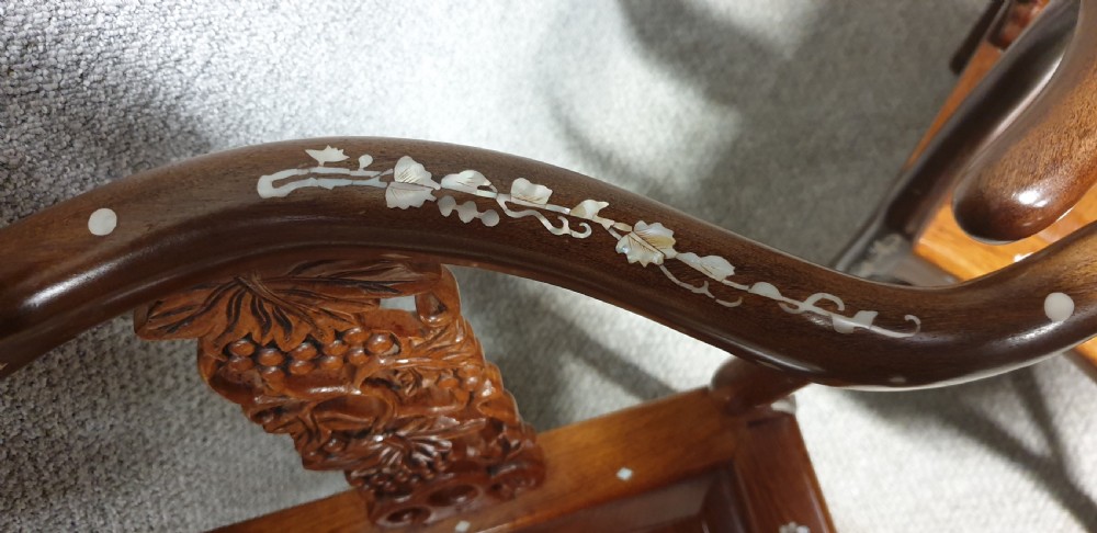 A pair of warm brown hardwood Chinese corner chairs featuring intricate mother-of-pearl floral inlays and carved pierced back splats. View XI