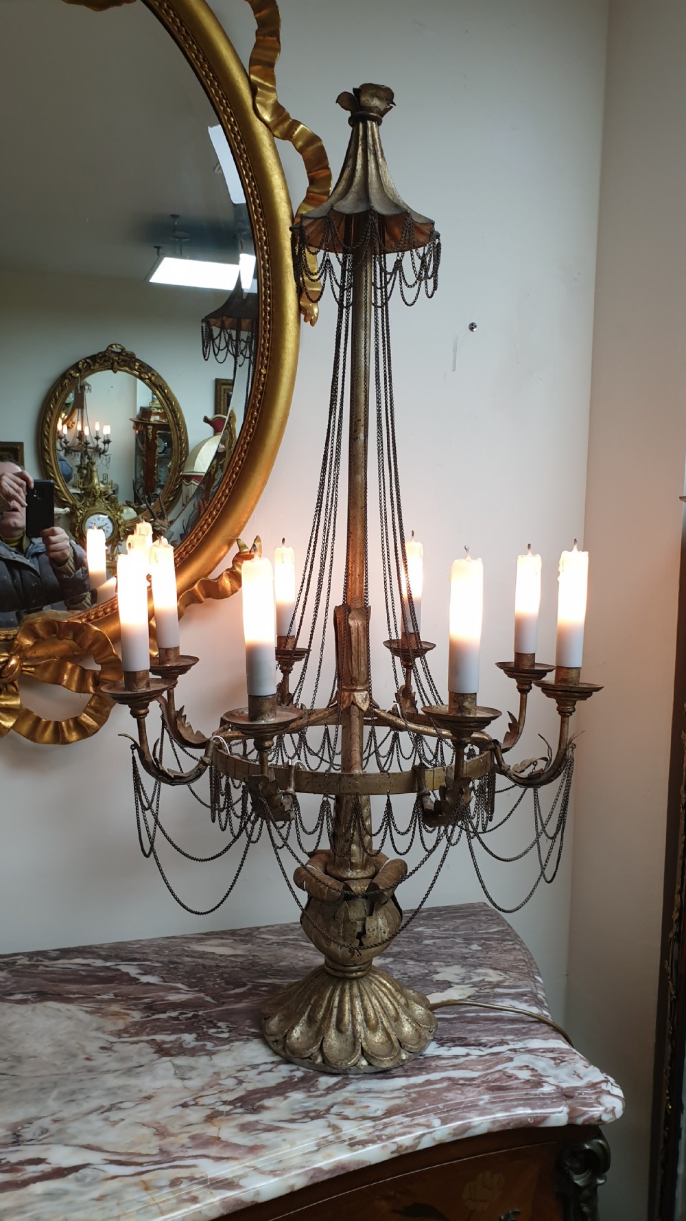 A pair of tall giltwood and metal eight-branch French candelabra table lamps featuring hanging wire swags and a tented canopy top. View II