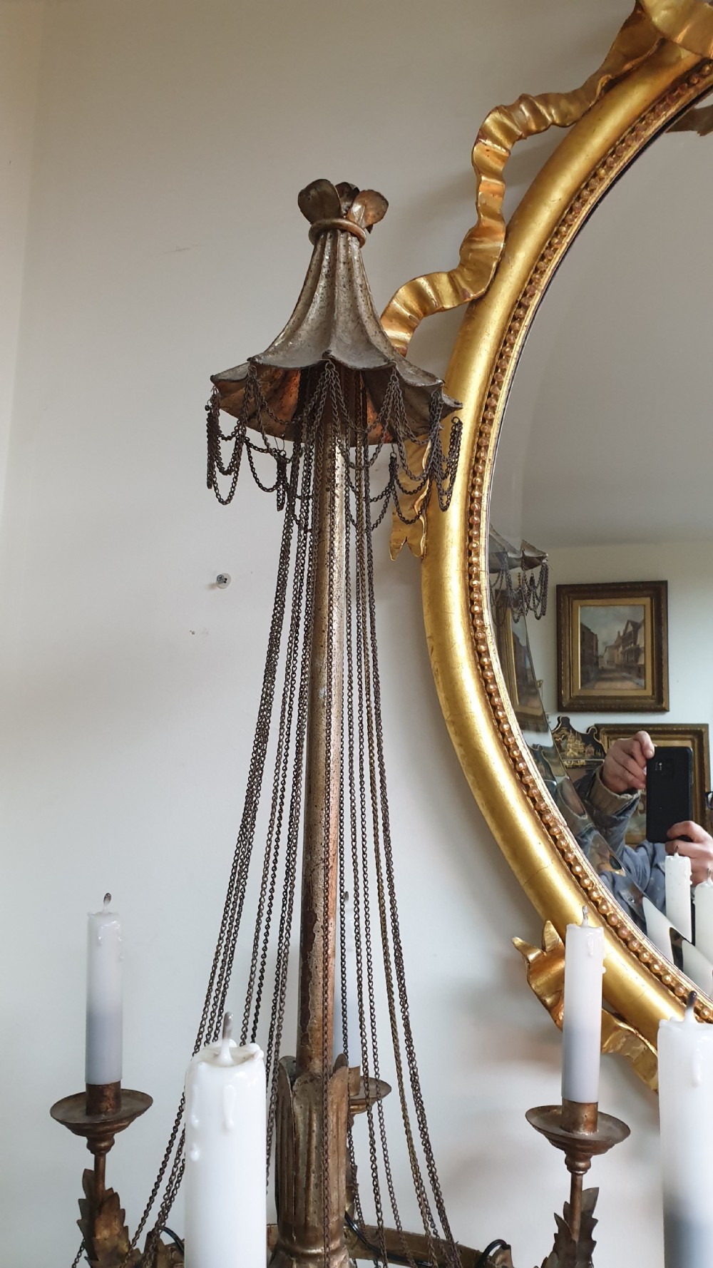 A pair of tall giltwood and metal eight-branch French candelabra table lamps featuring hanging wire swags and a tented canopy top. View VII