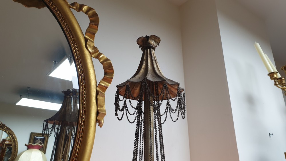 A pair of tall giltwood and metal eight-branch French candelabra table lamps featuring hanging wire swags and a tented canopy top. View XI