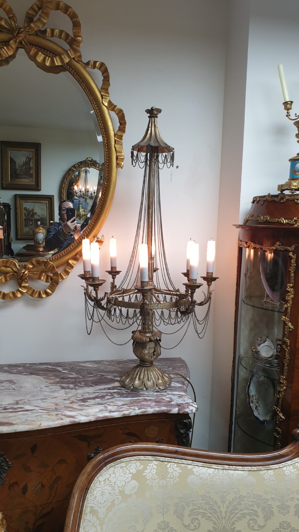 A pair of tall giltwood and metal eight-branch French candelabra table lamps featuring hanging wire swags and a tented canopy top. View XVI