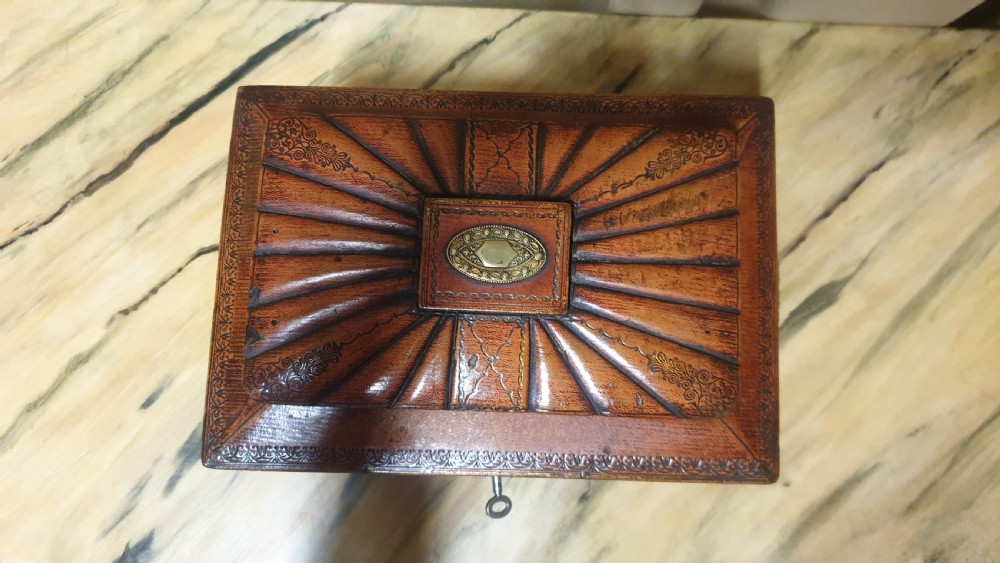 A Regency period tooled brown leather sewing box featuring a sarcophagus-shaped lid, cast brass claw feet, side ring handles, and a lower drawer. View IV