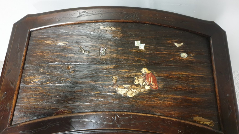 A dark brown Japanese lacquered work table featuring carved dragon head knees, a pierced apron, and a lower openwork shelf. View IV