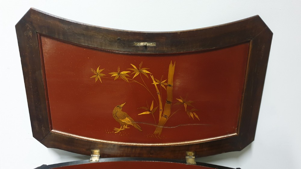 A dark brown Japanese lacquered work table featuring carved dragon head knees, a pierced apron, and a lower openwork shelf. View VI