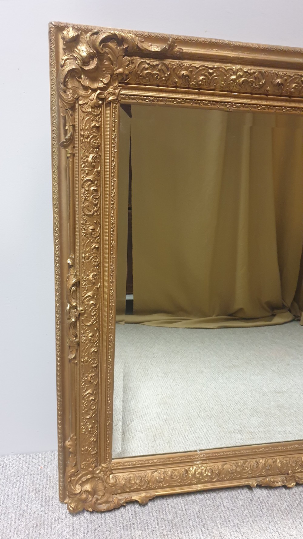 A large rectangular Victorian gilt wall mirror featuring an ornate frame embellished with acanthus leaf and scrollwork mouldings. View II