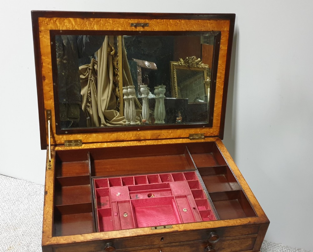 A William IV mahogany sewing table featuring two drawers with turned knobs, a gold fabric well underneath, and trestle supports joined by a turned stretcher. View IX