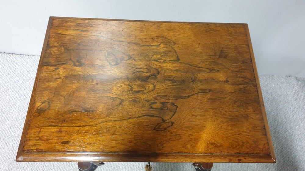 A William IV mahogany sewing table featuring two drawers with turned knobs, a gold fabric well underneath, and trestle supports joined by a turned stretcher. View XI