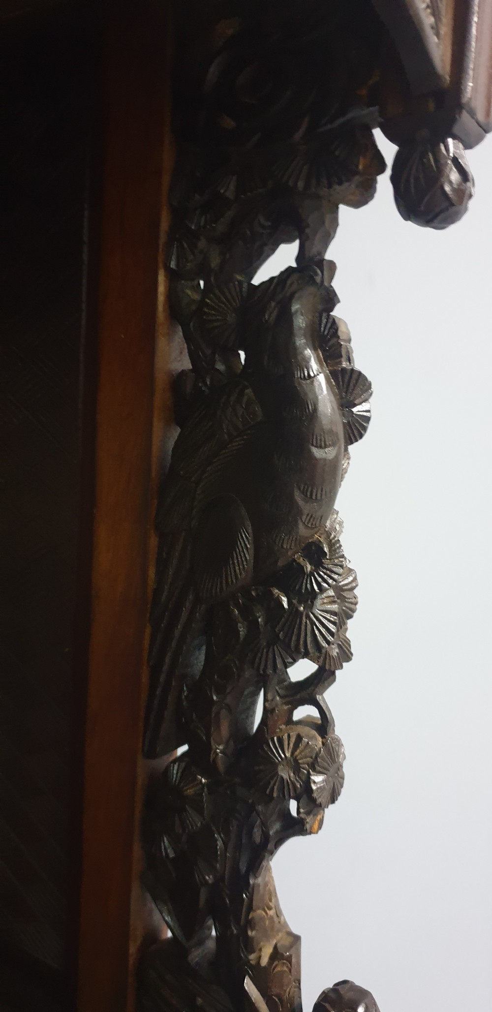 An intricately carved dark wood Japanese Meiji period Shibayama cabinet featuring multi-tiered asymmetrical shelves and gold lacquer panels inset with shell and bone motifs. View XIII