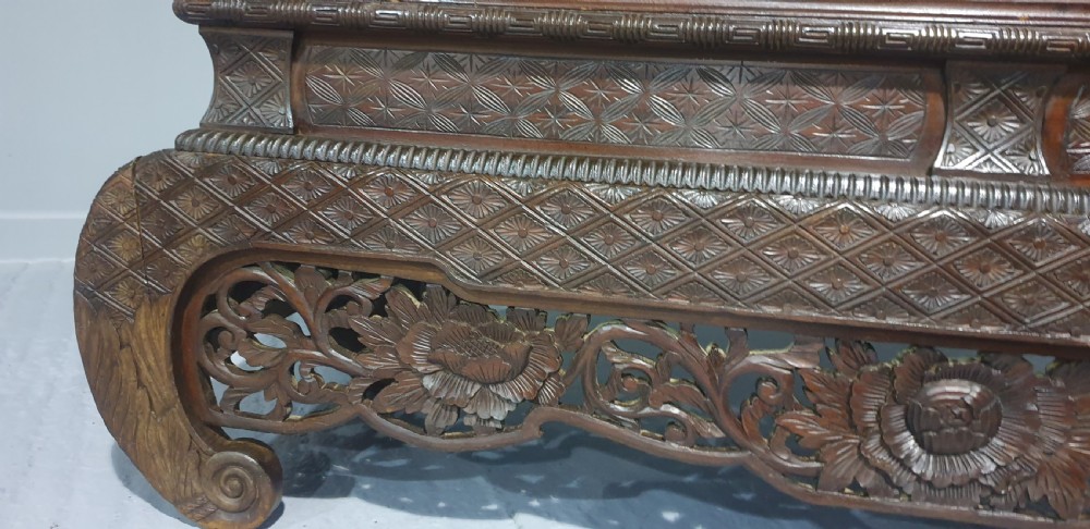 An intricately carved dark wood Japanese Meiji period Shibayama cabinet featuring multi-tiered asymmetrical shelves and gold lacquer panels inset with shell and bone motifs. View XXII