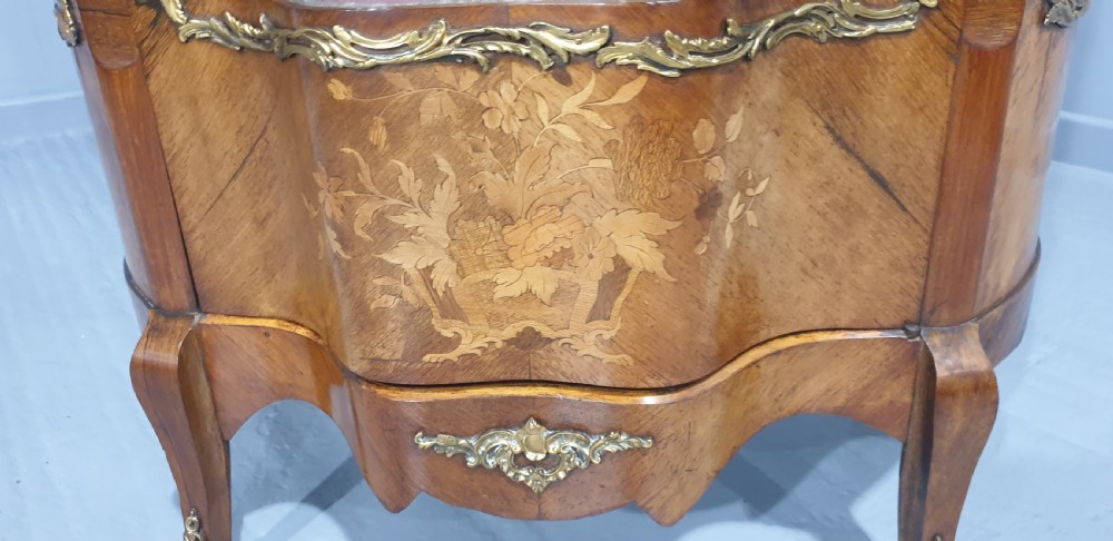 An antique French Louis XV style glazed vitrine display cabinet featuring curved glass sides, floral marquetry inlay, and detailed ormolu mounts. View VII