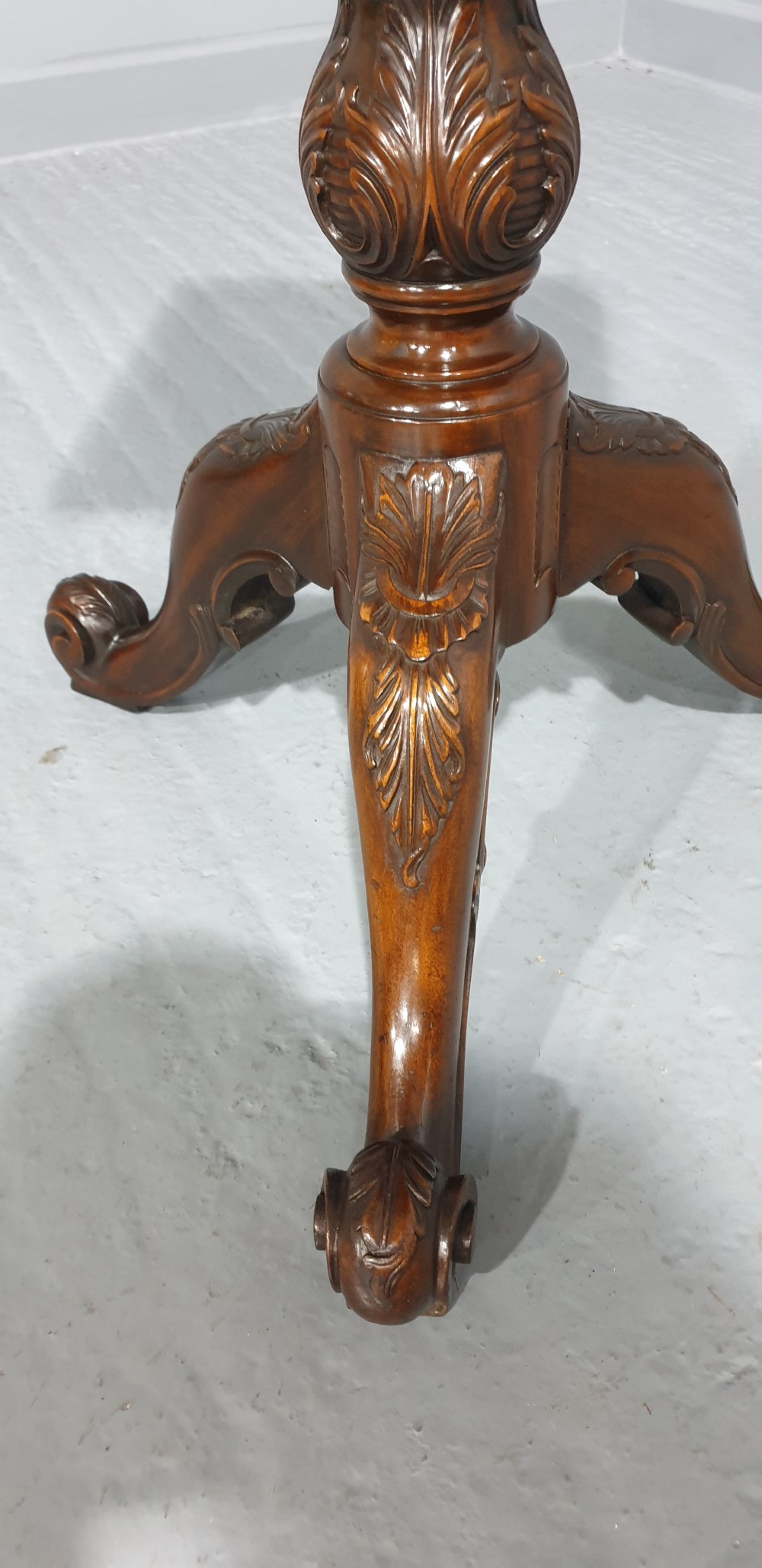 A mahogany tripod occasional table featuring a fretwork gallery top, a pull-out candle slide, a carved central column, and three carved legs. View VII