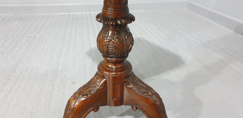 A mahogany tripod occasional table featuring a fretwork gallery top, a pull-out candle slide, a carved central column, and three carved legs. View IX