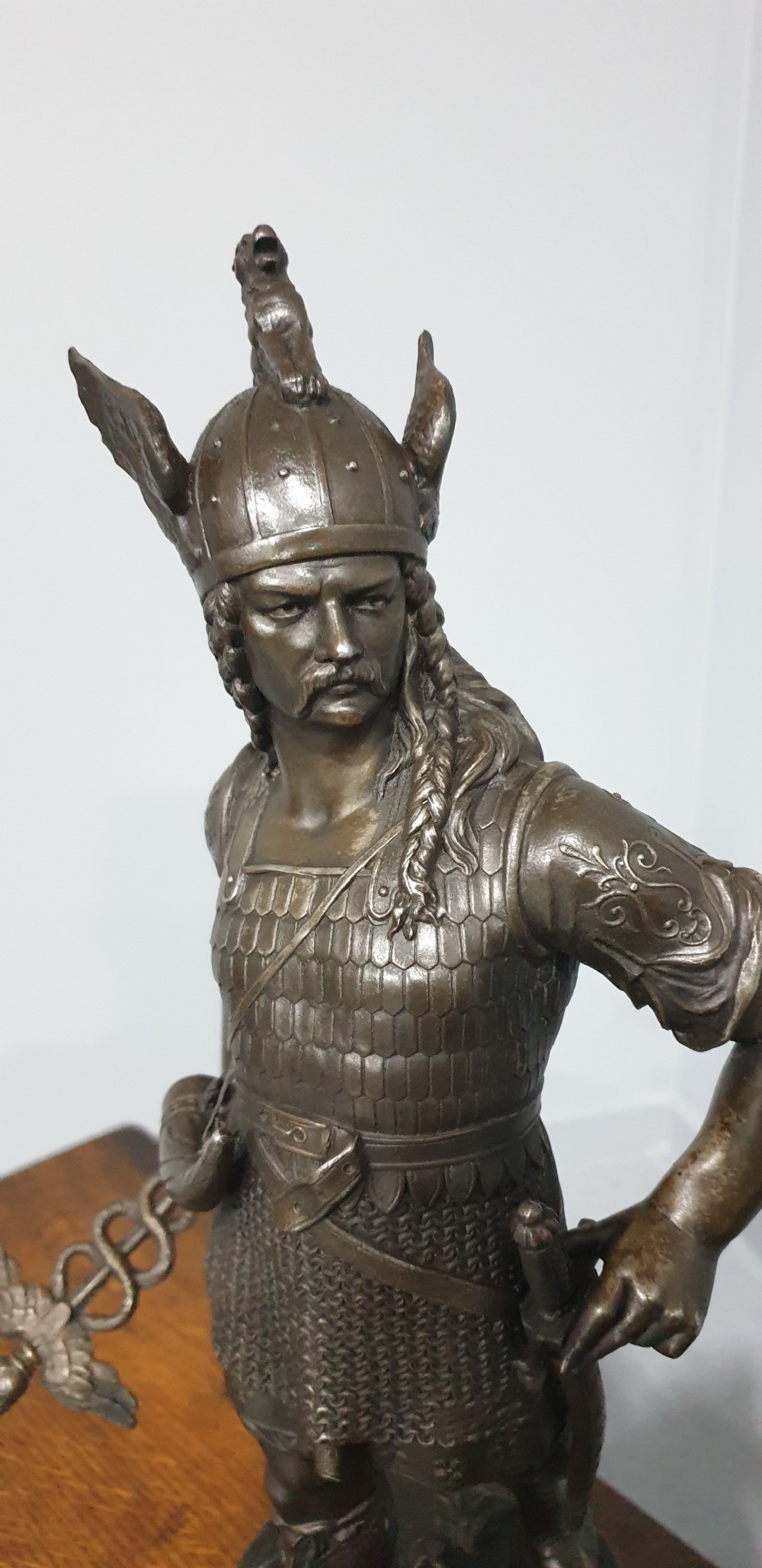 A pair of dark bronze-finished spelter statues depicting classical warriors wearing detailed armour and standing on relief-decorated bases. View IV