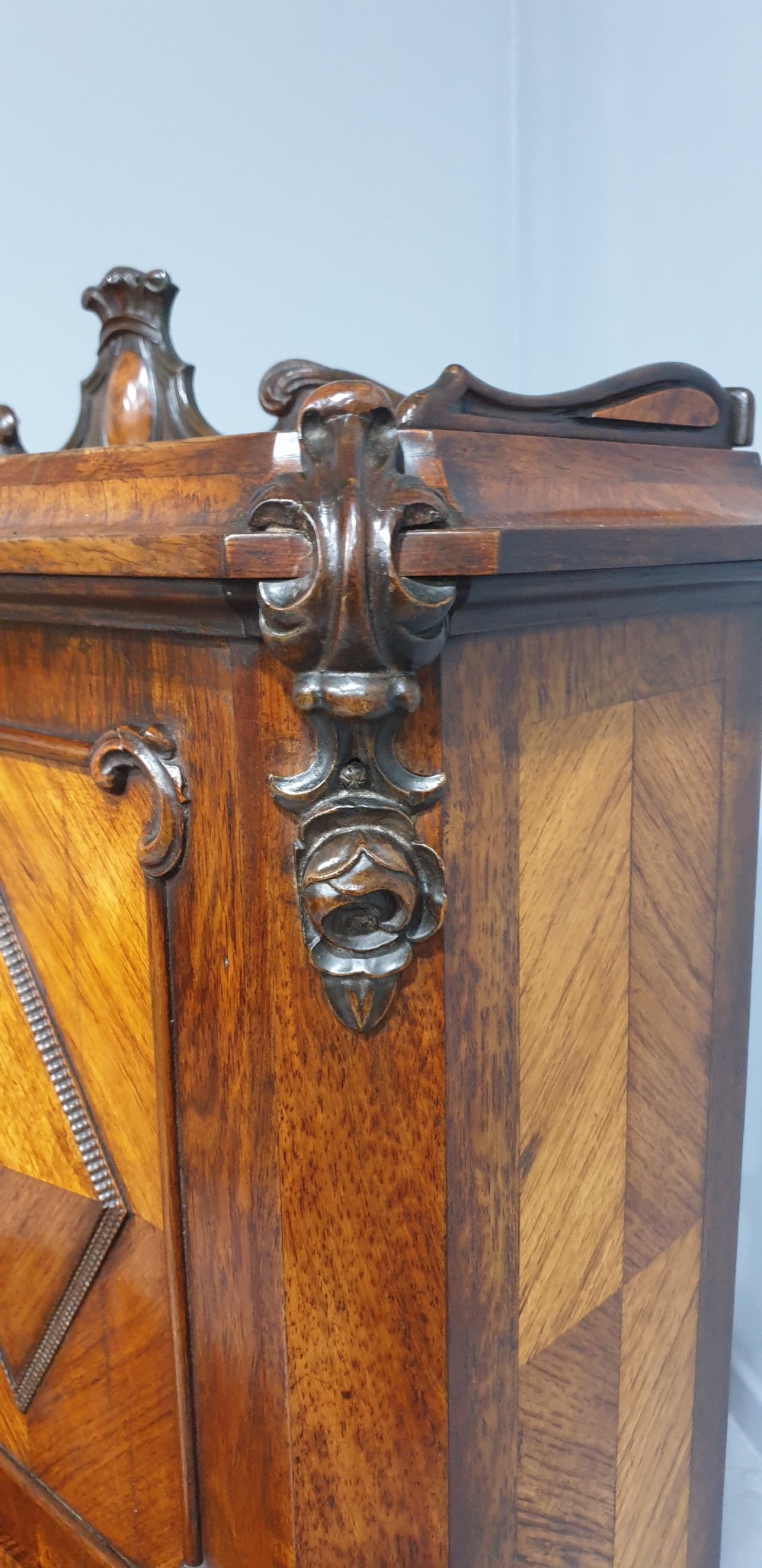 A French Bonheur du Jour writing desk in warm brown walnut with geometric diamond marquetry, cabriole legs, and an upper cabinet section with twin doors. View VII