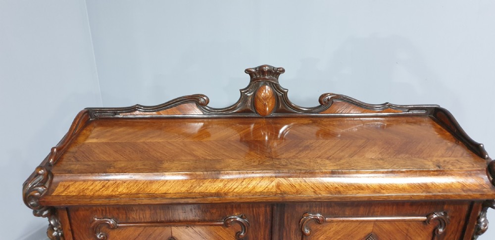A French Bonheur du Jour writing desk in warm brown walnut with geometric diamond marquetry, cabriole legs, and an upper cabinet section with twin doors. View IX