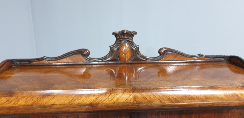 A French Bonheur du Jour writing desk in warm brown walnut with geometric diamond marquetry, cabriole legs, and an upper cabinet section with twin doors. View X