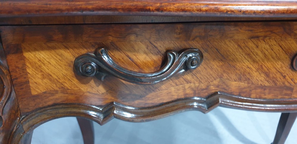 A French Bonheur du Jour writing desk in warm brown walnut with geometric diamond marquetry, cabriole legs, and an upper cabinet section with twin doors. View XIII