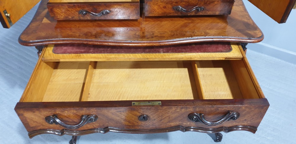 A French Bonheur du Jour writing desk in warm brown walnut with geometric diamond marquetry, cabriole legs, and an upper cabinet section with twin doors. View XVII