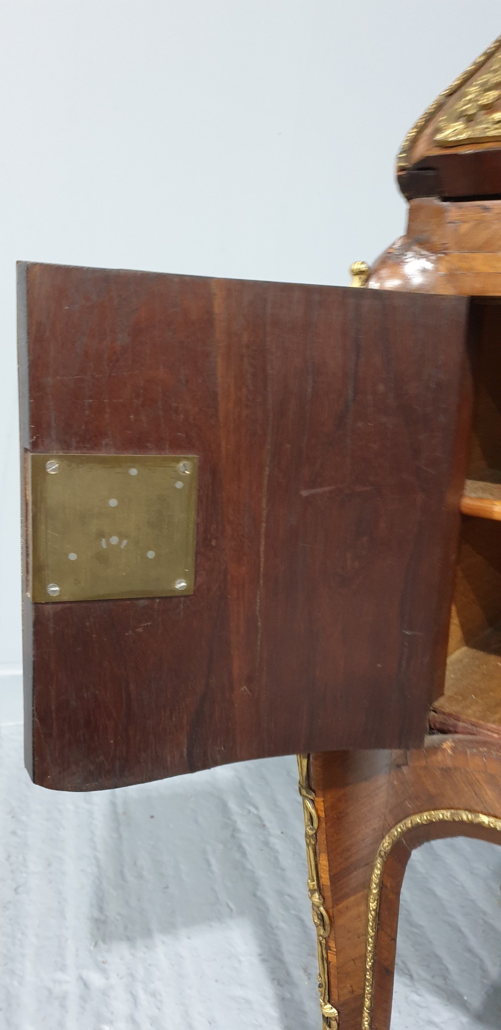 An early nineteenth-century French kingwood parquetry slant-front bureau featuring gilt-bronze ormolu mounts, cabriole legs, and geometric timber inlay. View XVI