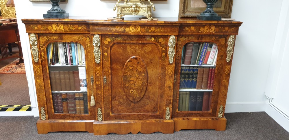 A low burr walnut and floral marquetry credenza bookcase featuring glazed side doors, a central solid panel door, and ornamental gilt-bronze mounts. View II