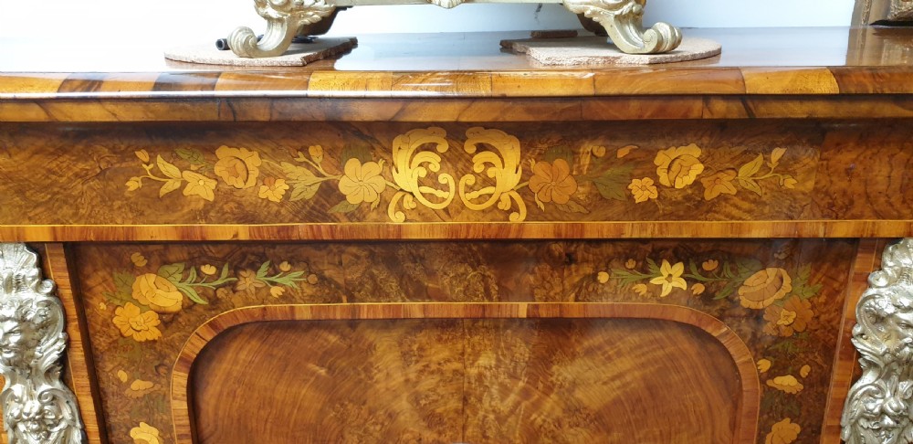 A low burr walnut and floral marquetry credenza bookcase featuring glazed side doors, a central solid panel door, and ornamental gilt-bronze mounts. View III