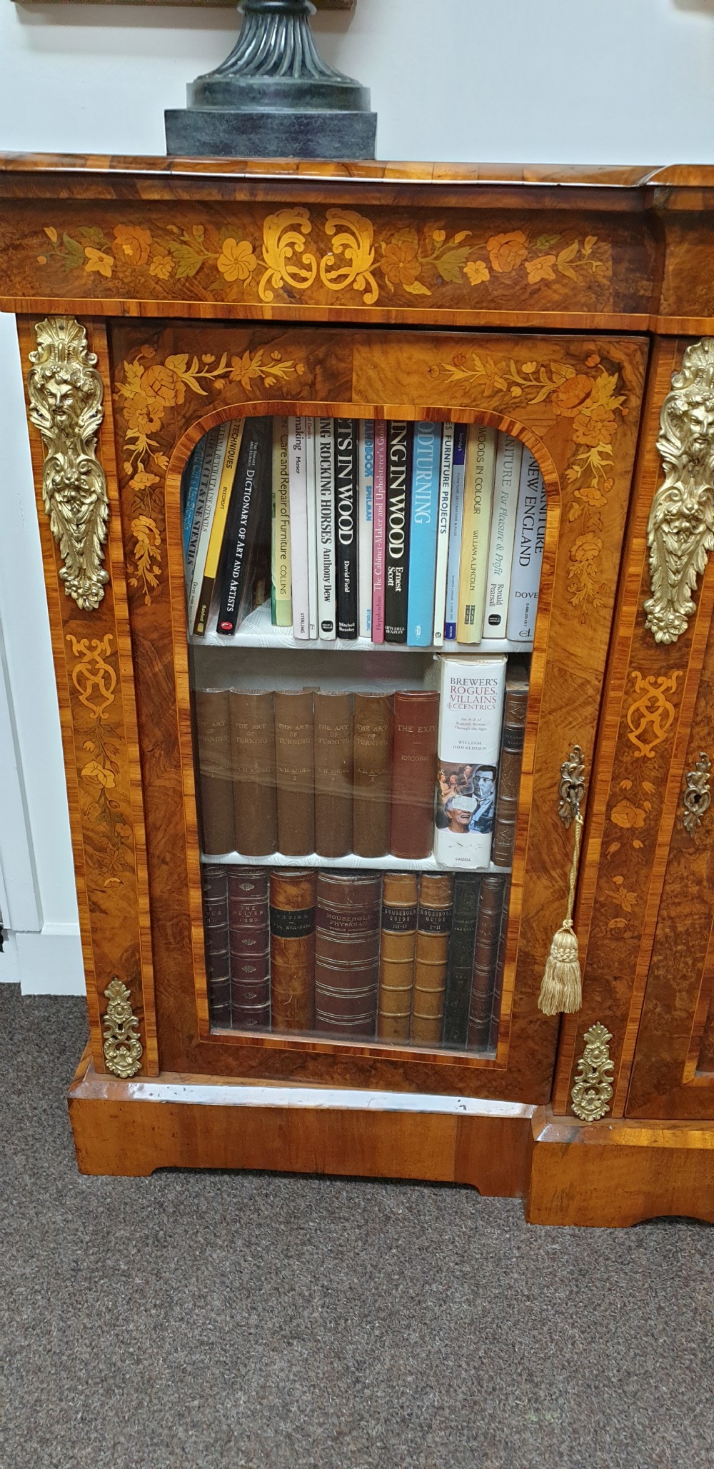 A low burr walnut and floral marquetry credenza bookcase featuring glazed side doors, a central solid panel door, and ornamental gilt-bronze mounts. View VI