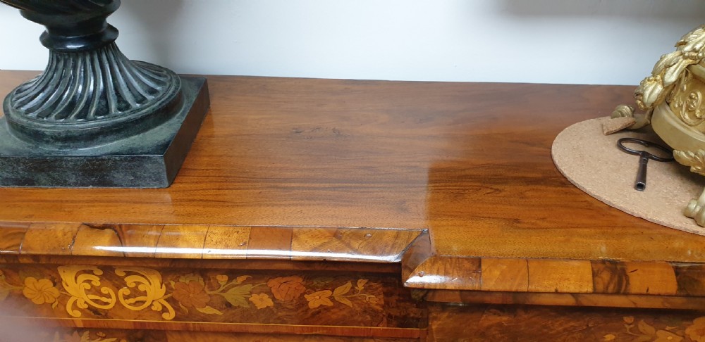 A low burr walnut and floral marquetry credenza bookcase featuring glazed side doors, a central solid panel door, and ornamental gilt-bronze mounts. View VIII