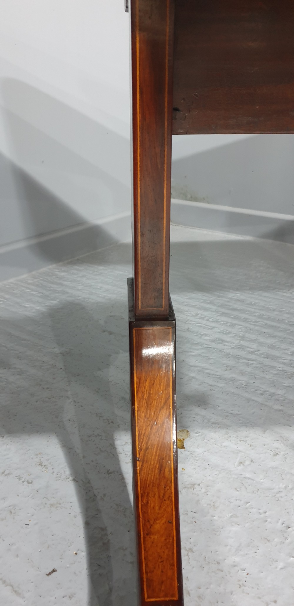 An 18th-century mahogany drop-leaf sofa table with two frieze drawers, crossbanded inlay, sabre legs, and brass castors. View XI