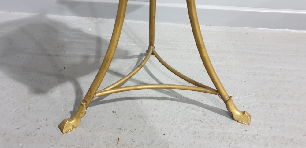 A small square revolving mahogany bookstand featuring brass vertical spindles, corner finials, and a tall tripod brass base with claw feet. View III