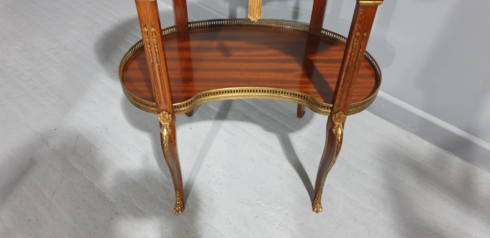 A French kidney-shaped mahogany side table featuring a marble top, upper brass gallery, lower shelf, and gilt bronze mounts. View III