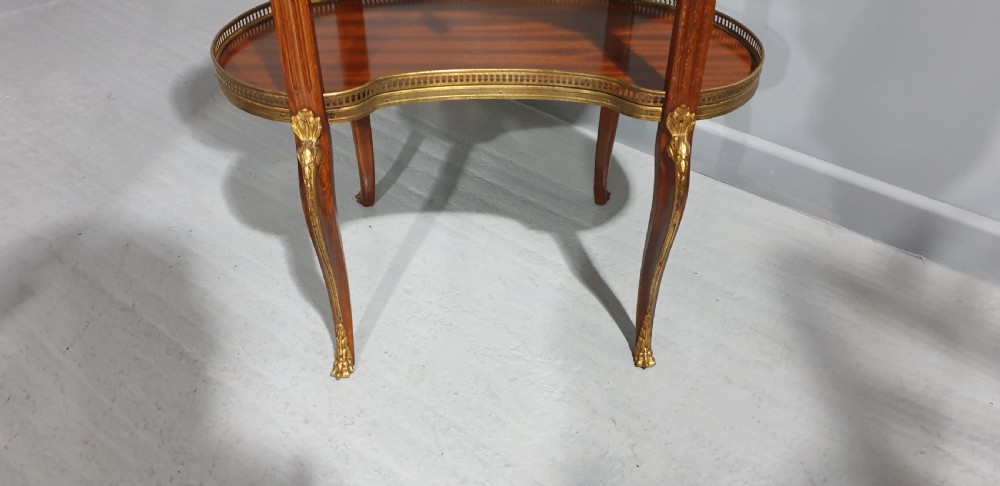 A French kidney-shaped mahogany side table featuring a marble top, upper brass gallery, lower shelf, and gilt bronze mounts. View IV